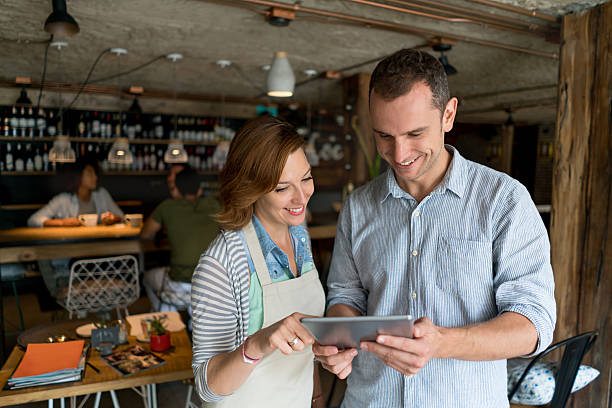 istock Waitress talking to manager at a restaurant 613132018