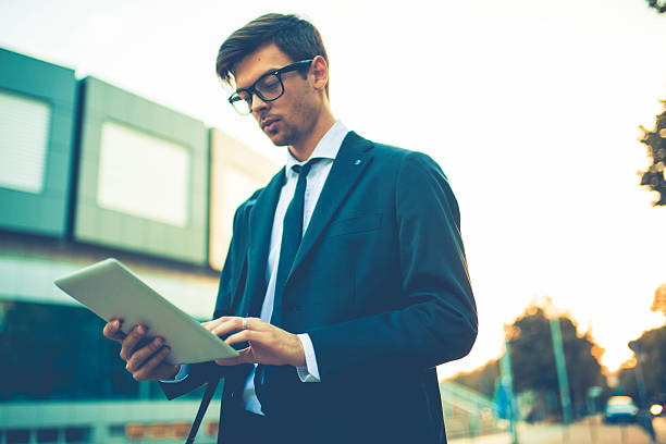 istock Young businessman working on his tablet 613135810