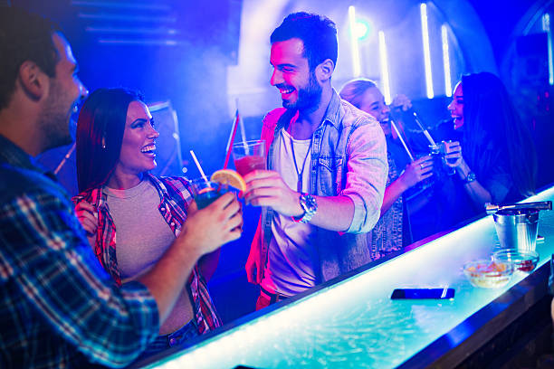 istock Young cheerful people having fun in nightclub. 613137374
