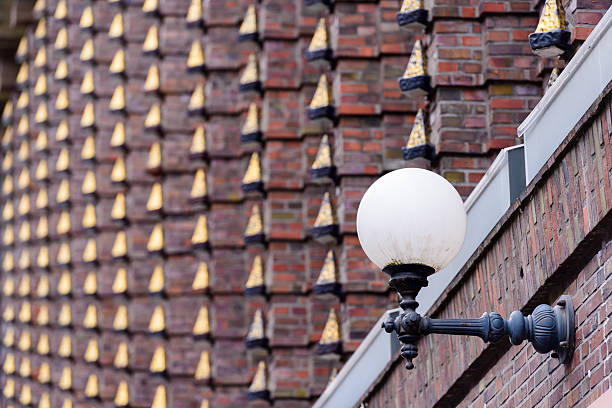 Golden elements of historical building facade, Hamburg, Germany. The Broschek-Haus was build in 1925–1926 in so called style of brick expressionism.