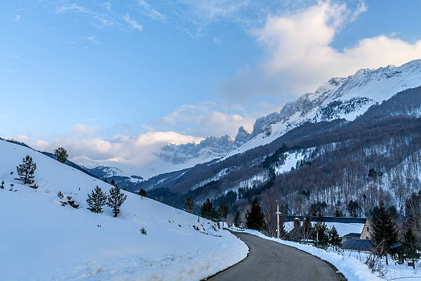 istock winter day in the forest road stand in navarra 613139618