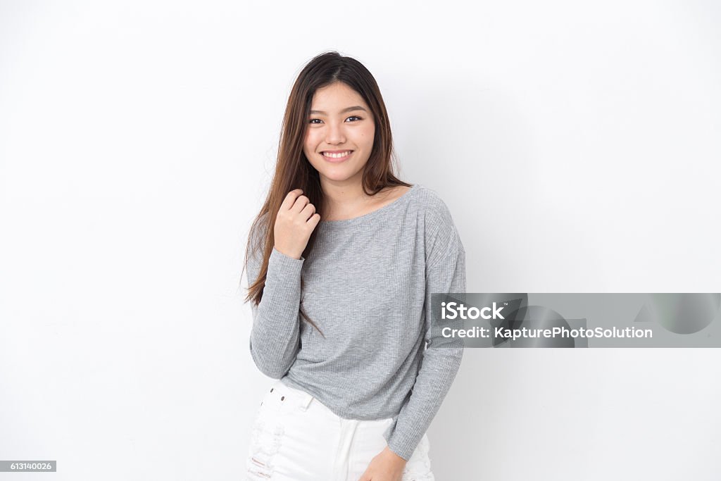 Asian girl posing for the camera Asian girl posing and smiling for the camera Fashion Stock Photo