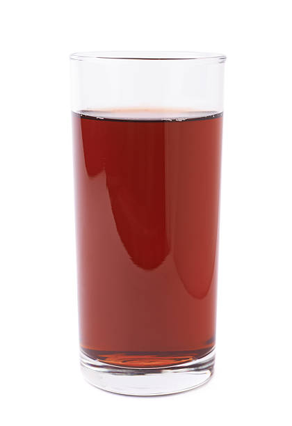 istock Glass filled with the red juice isolated 613140940