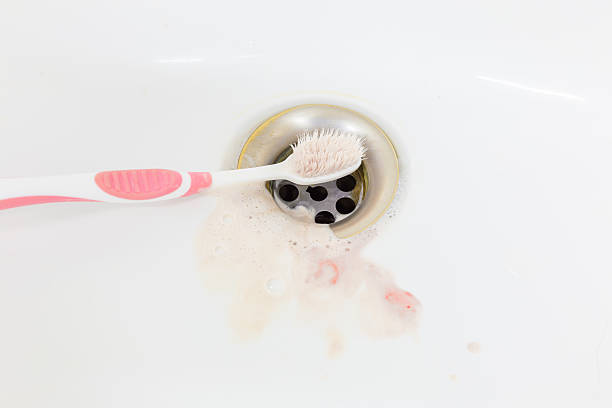 istock Blood on toothbrush in sink. 613141242