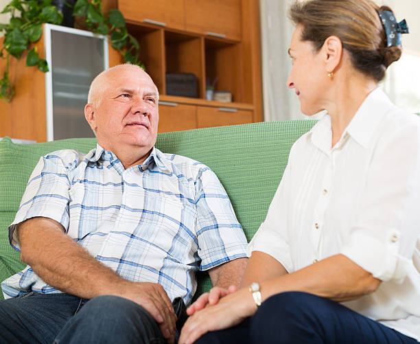 istock mature couple having serious talking at home 613142050