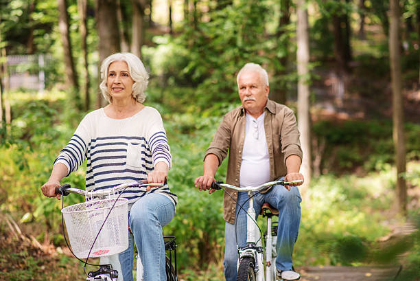 istock Joyful old married couple enjoying trip in forest 613142650