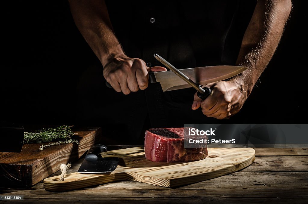 Chef butcher prepare beef steak Delicious beef steak, product photo, place for your advertisment Meat Stock Photo