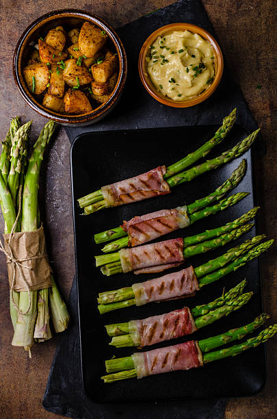 istock Asparagus on grill with bacon 613144722