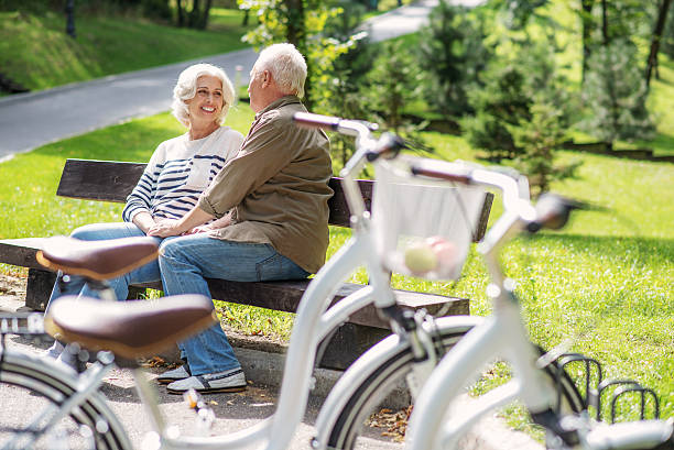 istock Mature lovers enjoying communication in park 613145122
