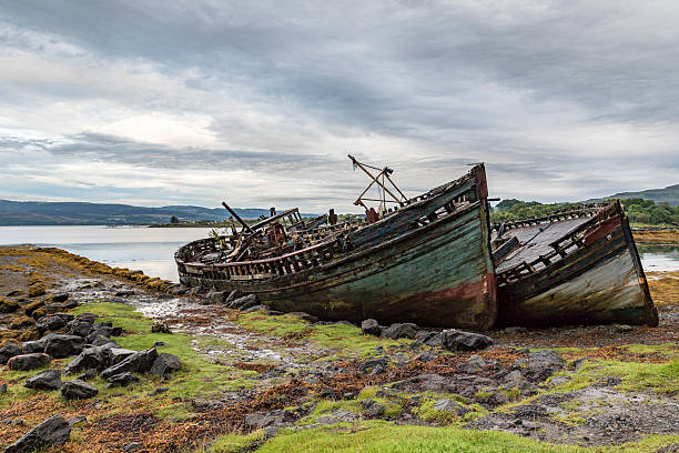 istock Fishing boat wrecks on Mull 613145692