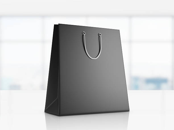 istock Black shopping bag in office 613146920