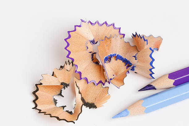 istock blue pencil with colorful shavings on a white background 613147474