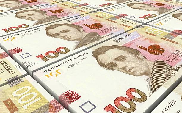 istock Ukrainian hryvnia bills stacks background. 613147640
