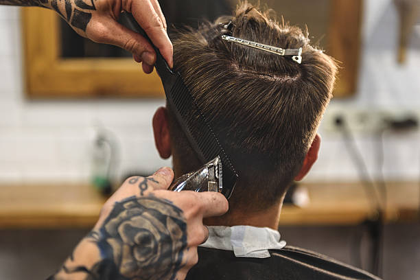 istock boy getting a haircut indoors 613148128