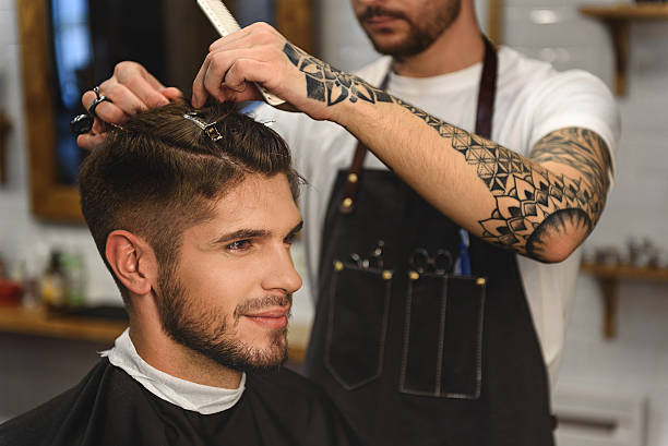 istock close up of customer getting haircut 613208106