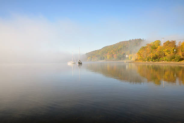 istock Two Sailboats on a Foggy Fall Morning 613208536