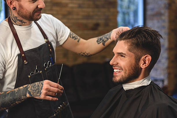 istock happy bearded man getting haircut 613208592