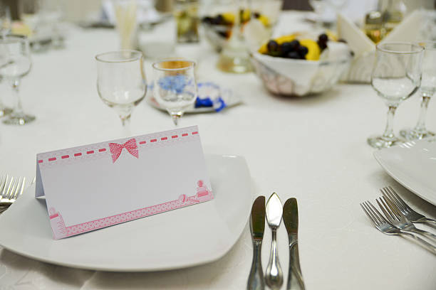Restaurant place setting with wine glasses at a reception