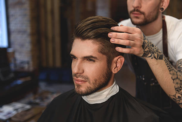 istock hairdresser doing final touches 613209292