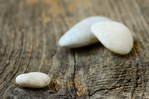 Stones isolated on wood background