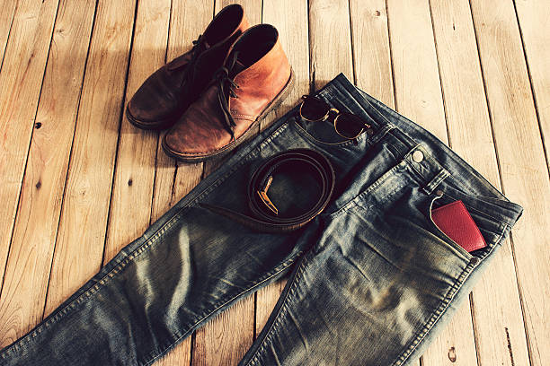 istock Jean,Wallet,leather shoes,sunglasses and Belt on wood background 613210708