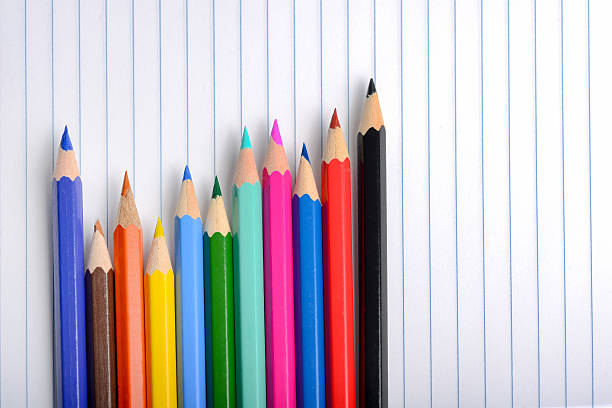 istock Different colorful crayons on a school paper 613211626