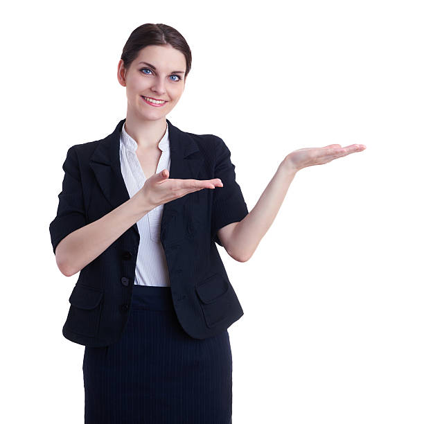istock Smiling businesswoman standing over white isolated background 613211780