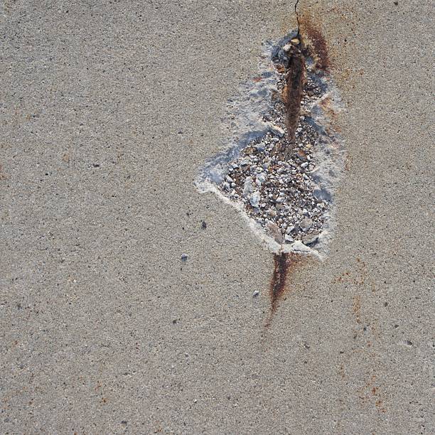 istock Damaged Concrete with Rebar exposed 613212178