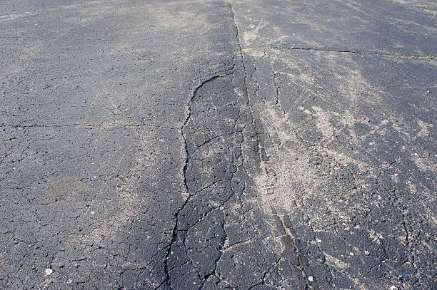 istock Damaged and Cracked Asphalt 613212188