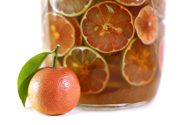 istock Lemon with rosy pulp and honey in glass jars 613212740