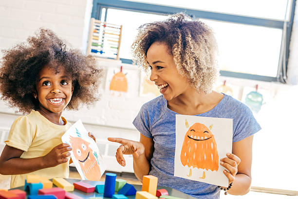 Being a good parent Laughing mother and child, Note to inspector: Property release for painted monsters are attached drawing art product photos stock pictures, royalty-free photos & images
