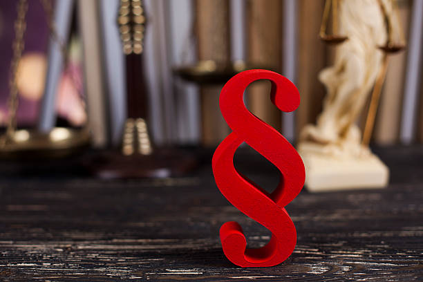 istock Judges wooden gavel and paragraph 613214390