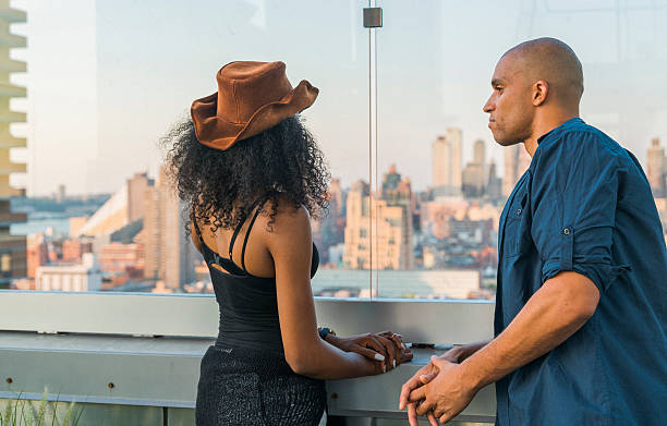 istock Young Latino couple have dinner and dating on rooftop 613215014