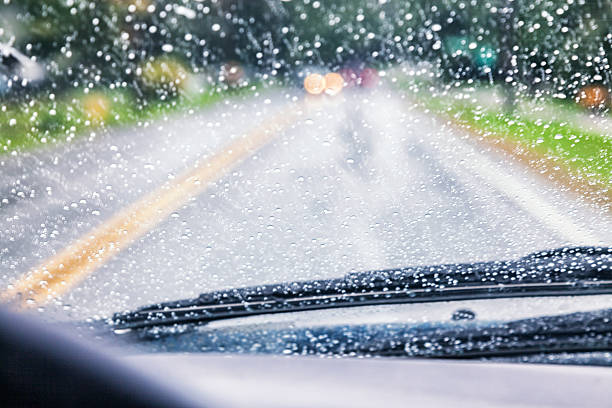 istock Highway Driving POV Through Spattered Car Windshield During Rain Storm 613216154