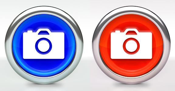 Camera Icon on Button with Metallic Rim. The icon comes in two versions blue and red and has a shiny metallic rim. The buttons have a slight shadow and are on a white background. The modern look of the buttons is very clean and will work perfectly for websites and mobile aps.