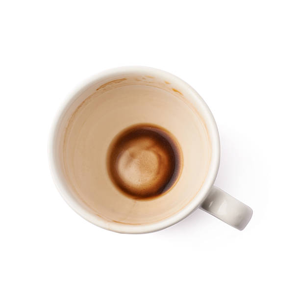 istock Used empty cup of coffee isolated 613217360