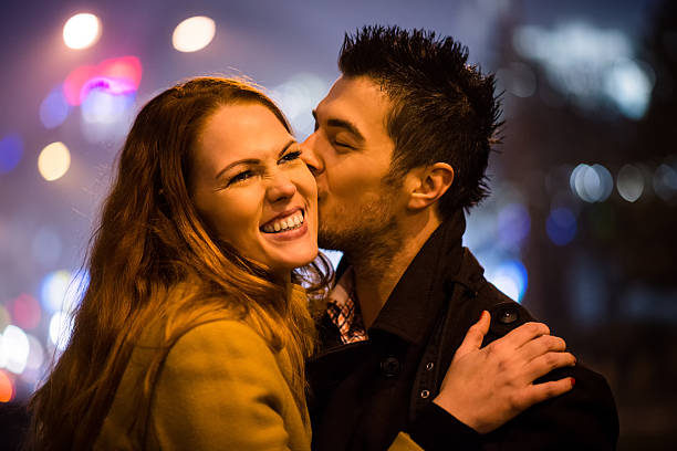 istock Winter time - couple in street 613217714