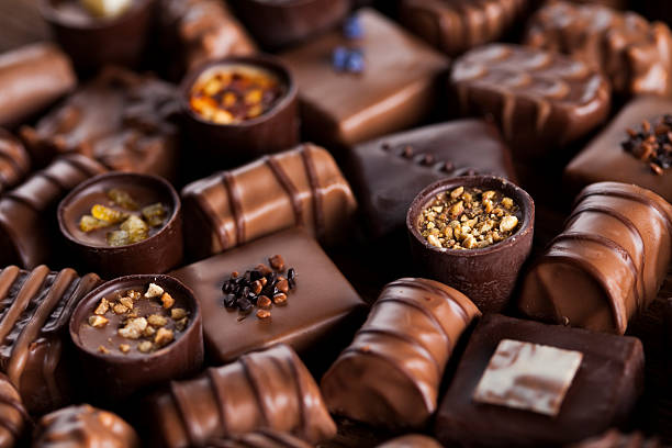 istock Praline Chocolate on wooden backgroud 613218856