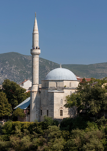 Mostar, Bosnia snd Herzegovina - August 12, 2015: White mosque in old town of Mostar in Bosnia and Herzegovina