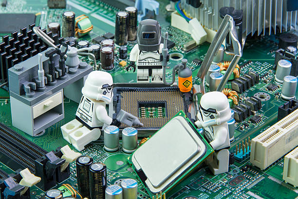 lego star wars repairing computer motherboard - close up small circuit board computer chip imagens e fotografias de stock