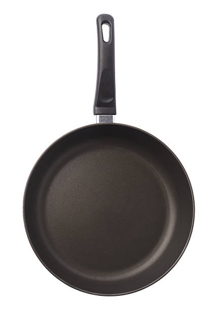 istock Black metal frying pan isolated 613221404