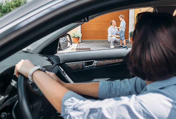 istock Mother waits her son in auto 613221838