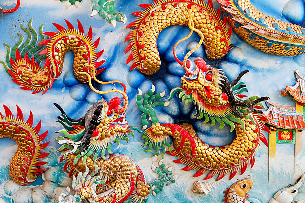 istock Golden dragon on Chinese temple wall 613221996