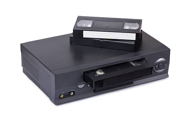 istock Old VHS video recorder and cassettes 613222436