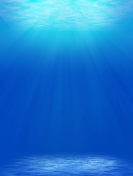 istock underwater backgrounds with sun ray and water ripple. 613223420