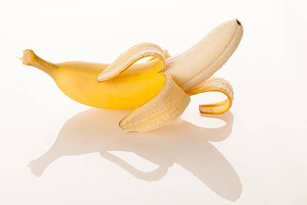 istock BPilled sweet banana isolated over white background 613225190