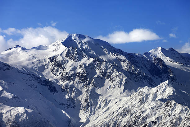 istock Snow winter mountains at nice sun day 613226088