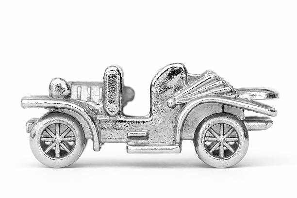 Metal chrome model vintage car on a white background