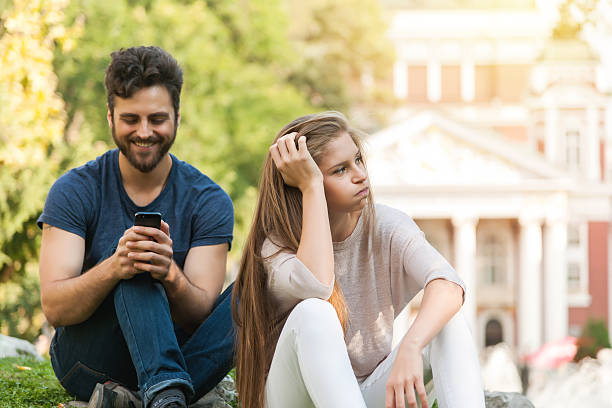 Girl bored, her boyfriend wrote in the social network stock photo