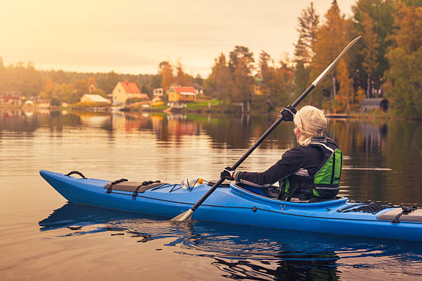 Woman kayaking on a lake